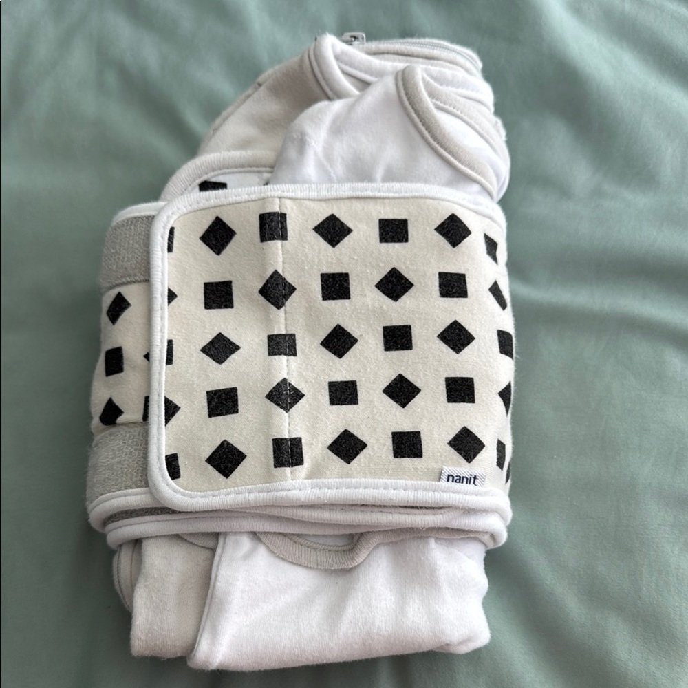 Baby sleep sacks and bands from Nanit  one is 0-3 months the other is 3-6 month